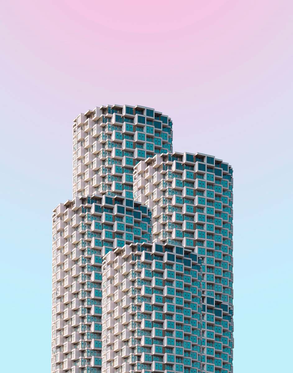 high rise gray concrete building under clear blue sky urban